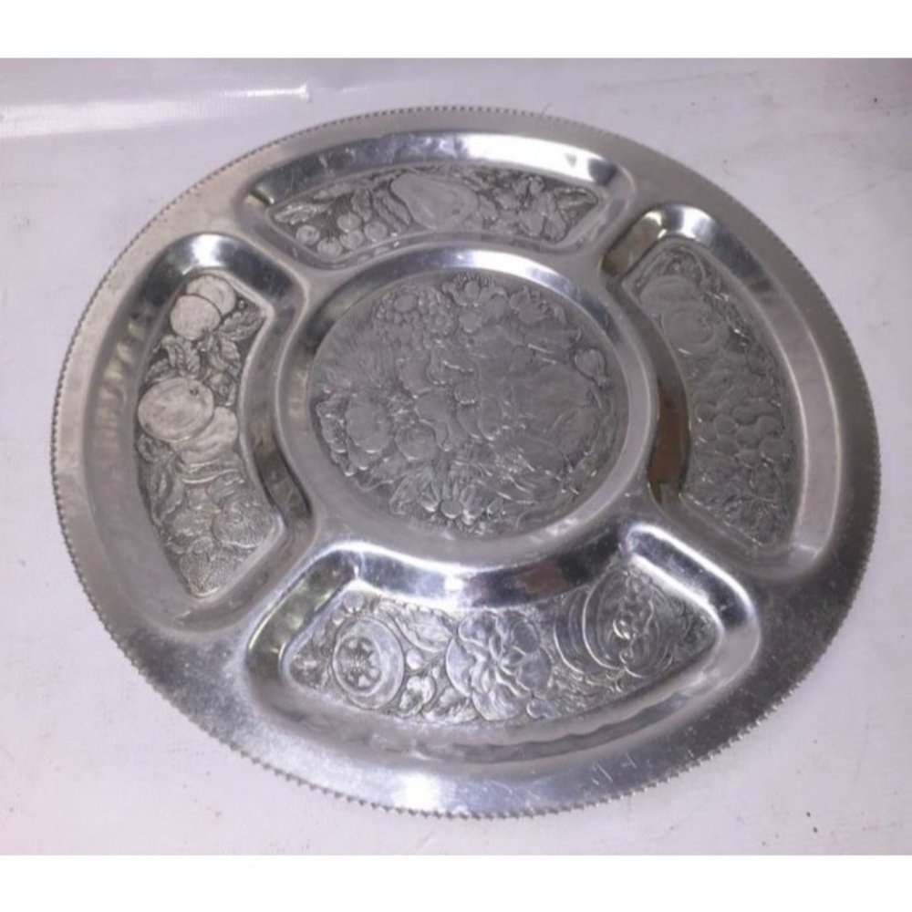 Silver serving tray that spins- many details etched in each segment - very nice